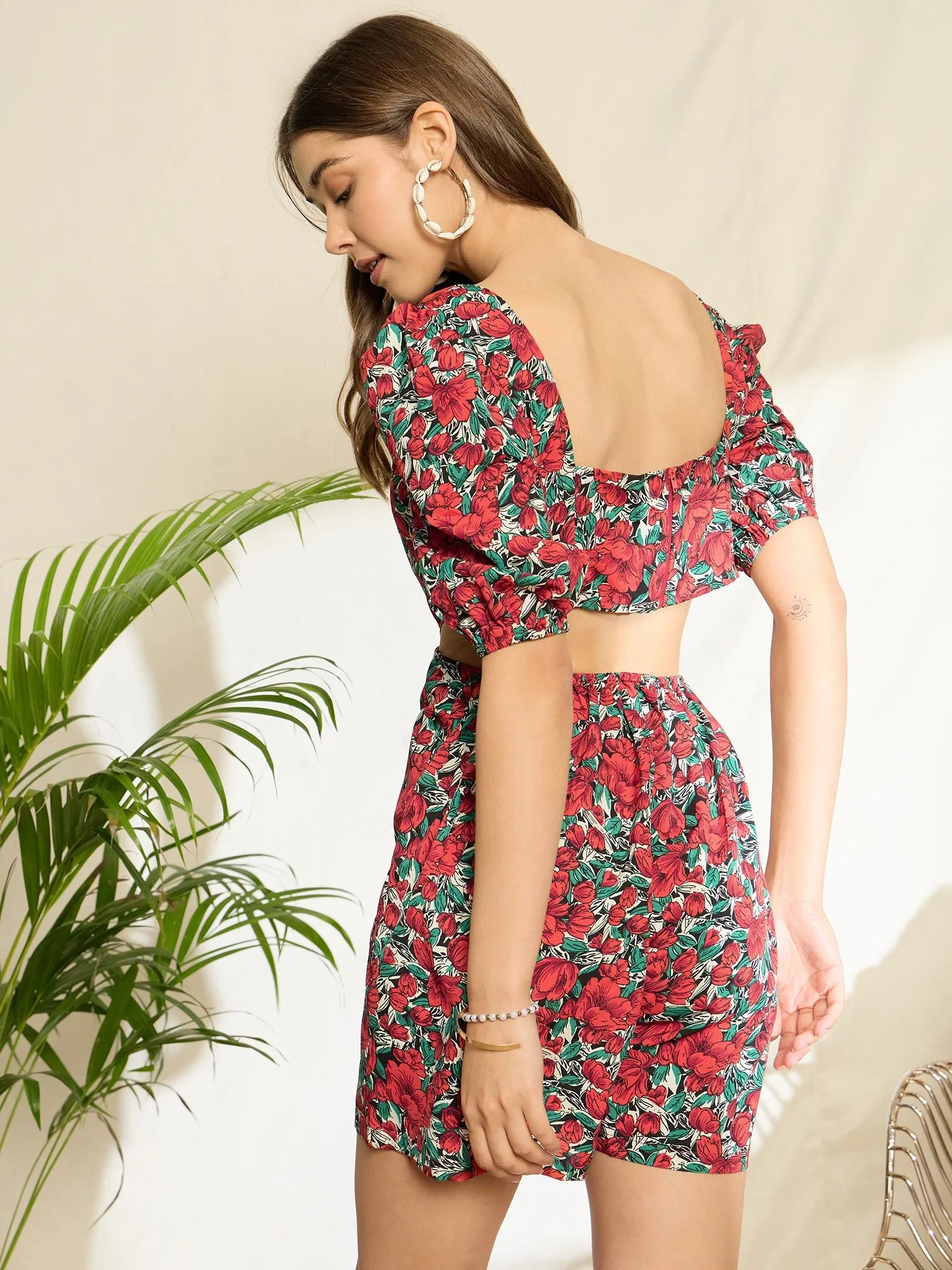Berrylush Women Red & Green Floral Printed Square Neck Puff Sleeves Waist Cutout Mini Jumpsuit